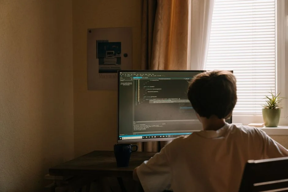 Close-up of vibrant HTML code displayed on a computer screen, showcasing web development and programming.
